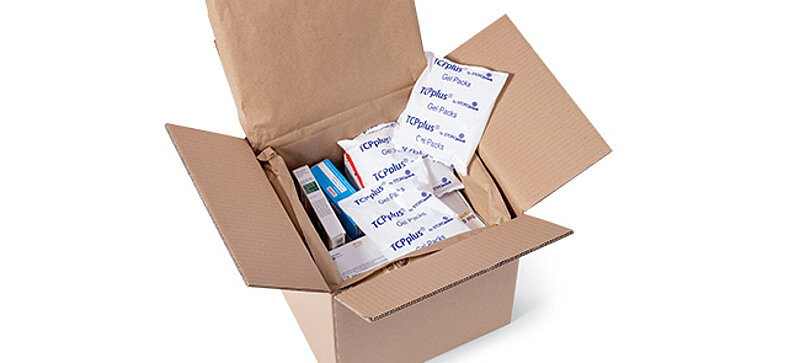 
		  Image of an open shipping box containing medications and ice packs.