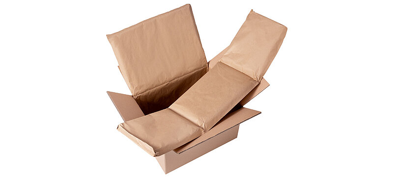 Image of an open cardboard box containing paper padding.